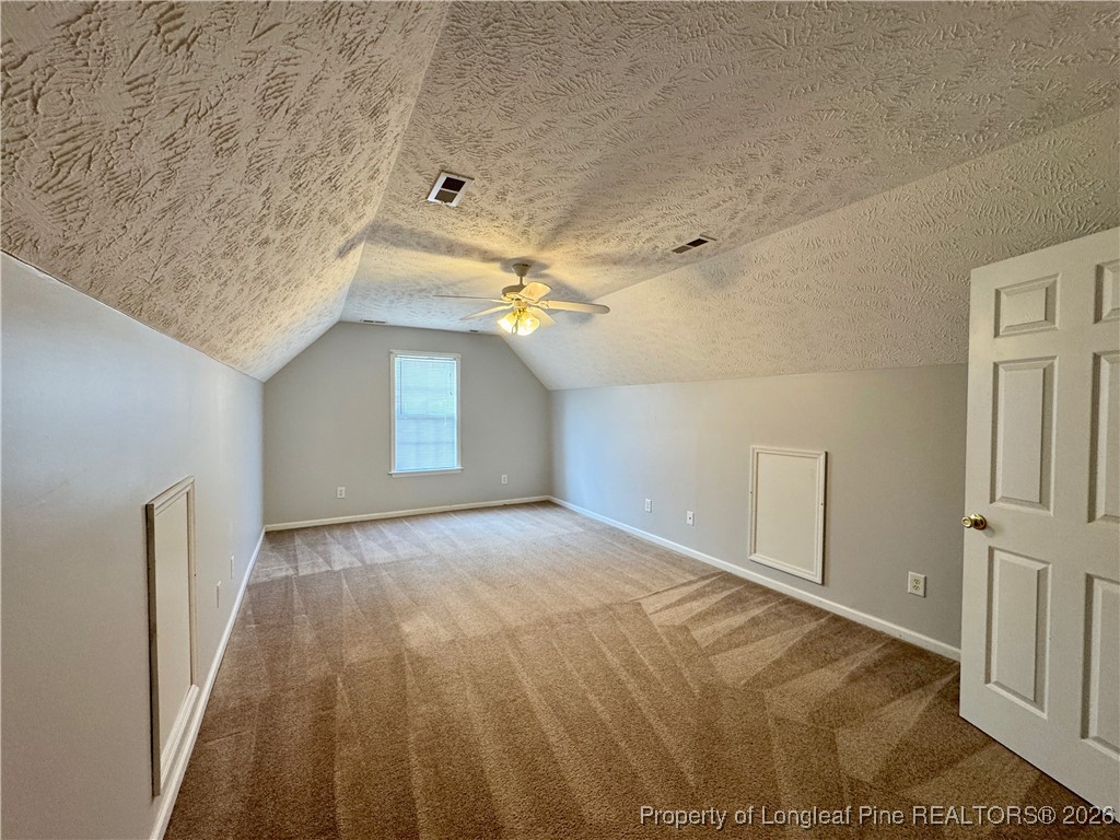 5503 Rising Ridge Drive Hope Mills, NC 28348 - Photo 16 of 18 a view of a big room with closet and chandelier fan