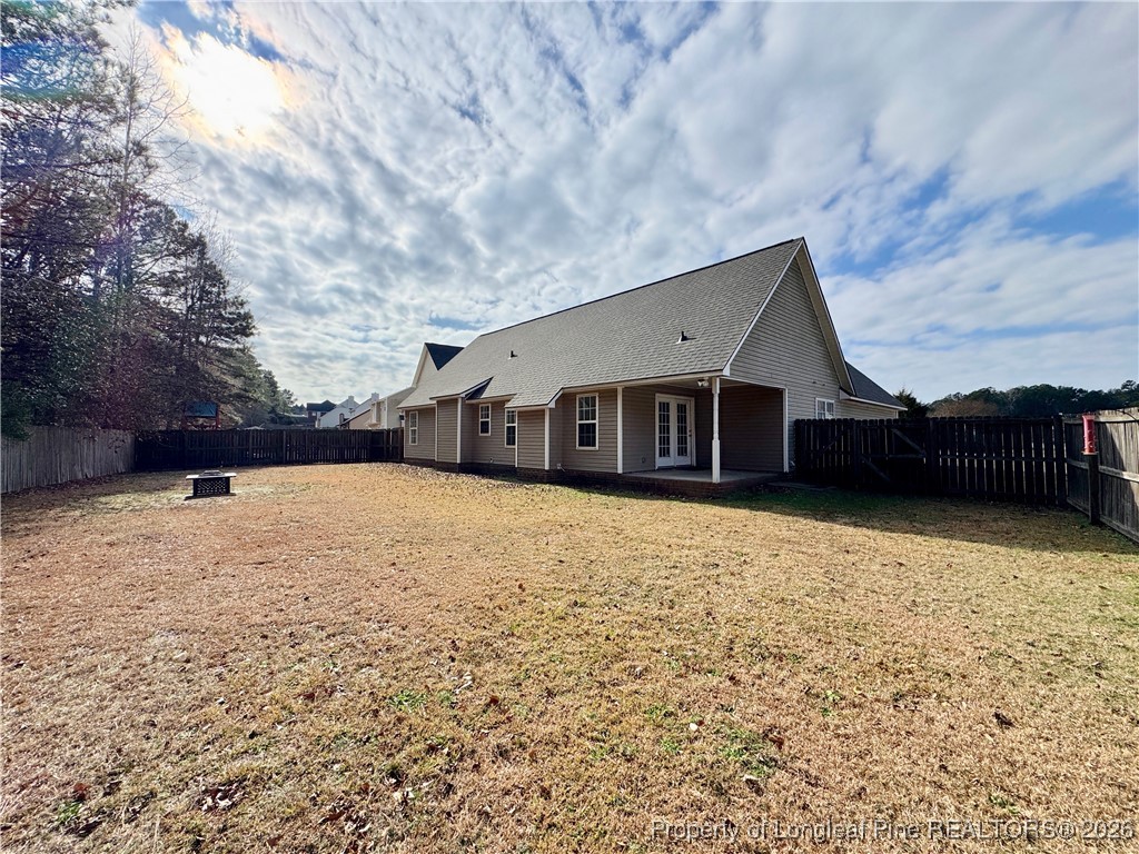 5503 Rising Ridge Drive Hope Mills, NC 28348 - Photo 17 of 18 a front view of a house with a yard