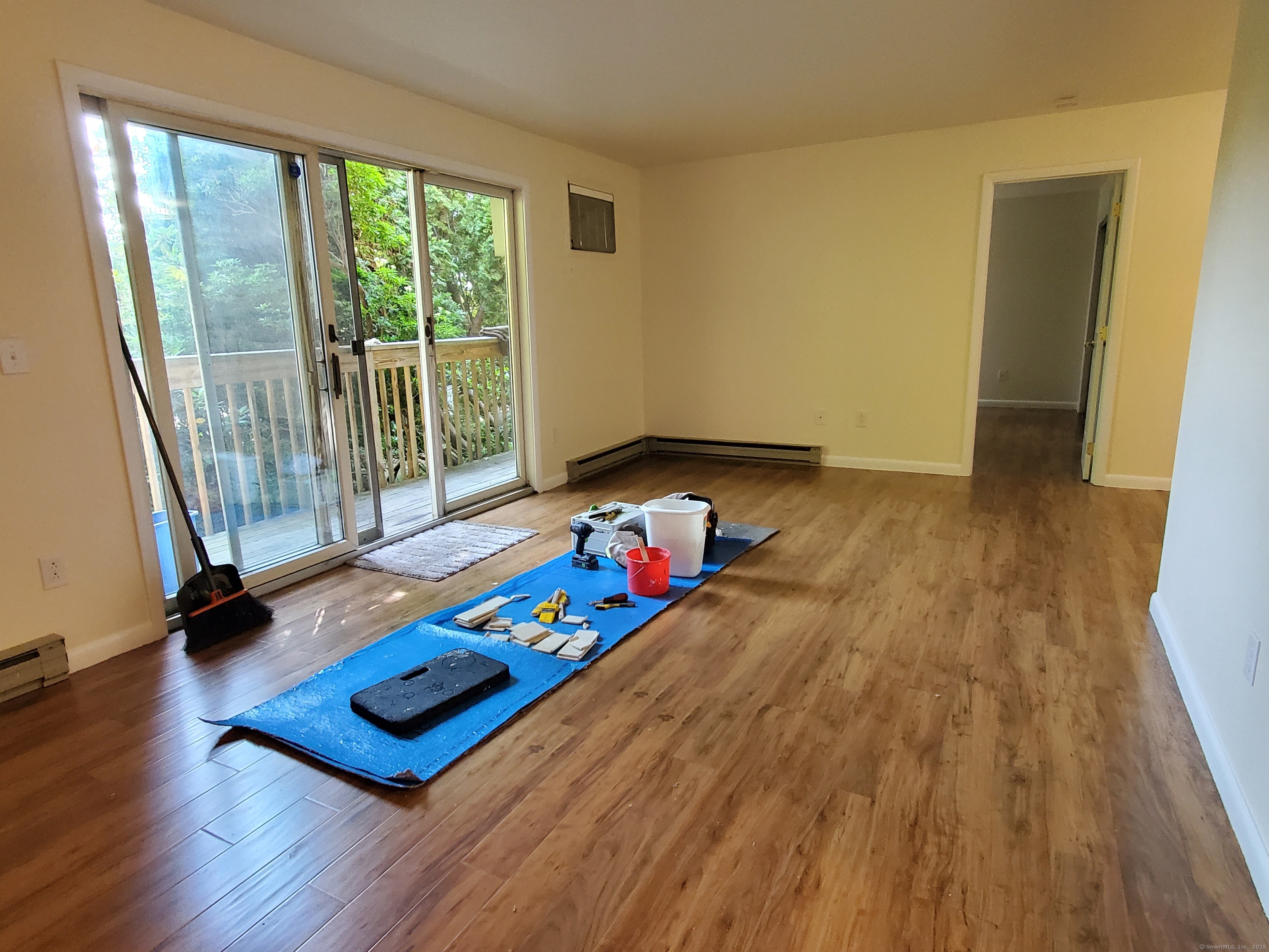 1 Rock Spring Road Stamford, CT 06906 - Photo 4 of 4 a living room with furniture and a wooden floor