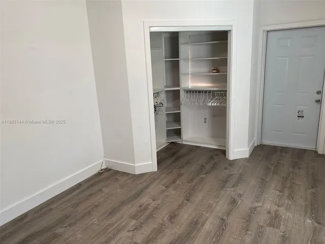 a bedroom with a bed and dresser