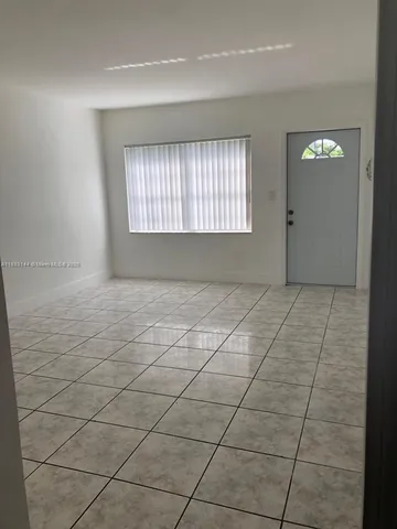 a view of an empty room and window