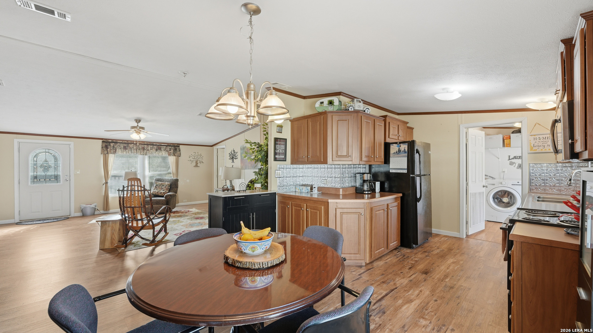 22071 Morin Road Von Ormy, TX 78073 - Photo 12 of 31 a kitchen with a table and chairs in it