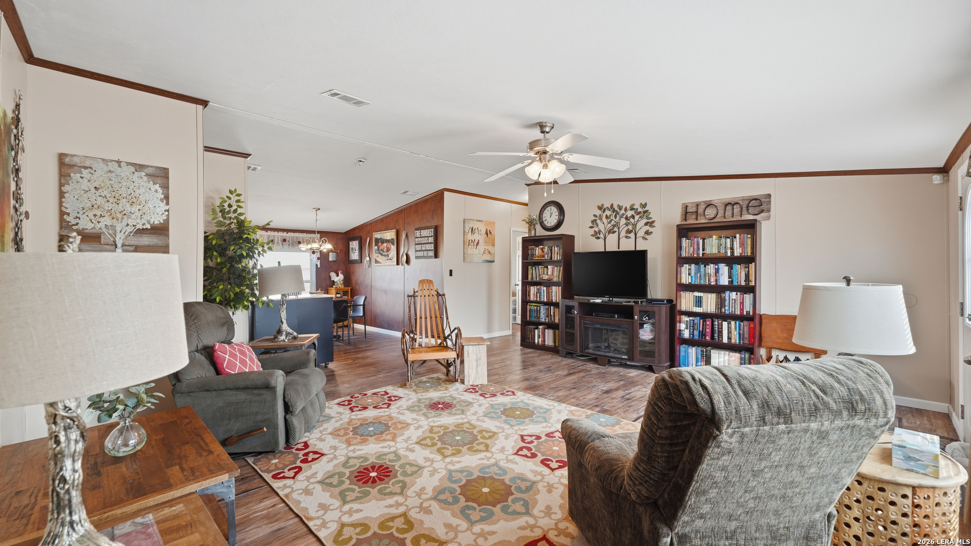 22071 Morin Road Von Ormy, TX 78073 - Photo 14 of 31 a living room with furniture fireplace and flat screen tv