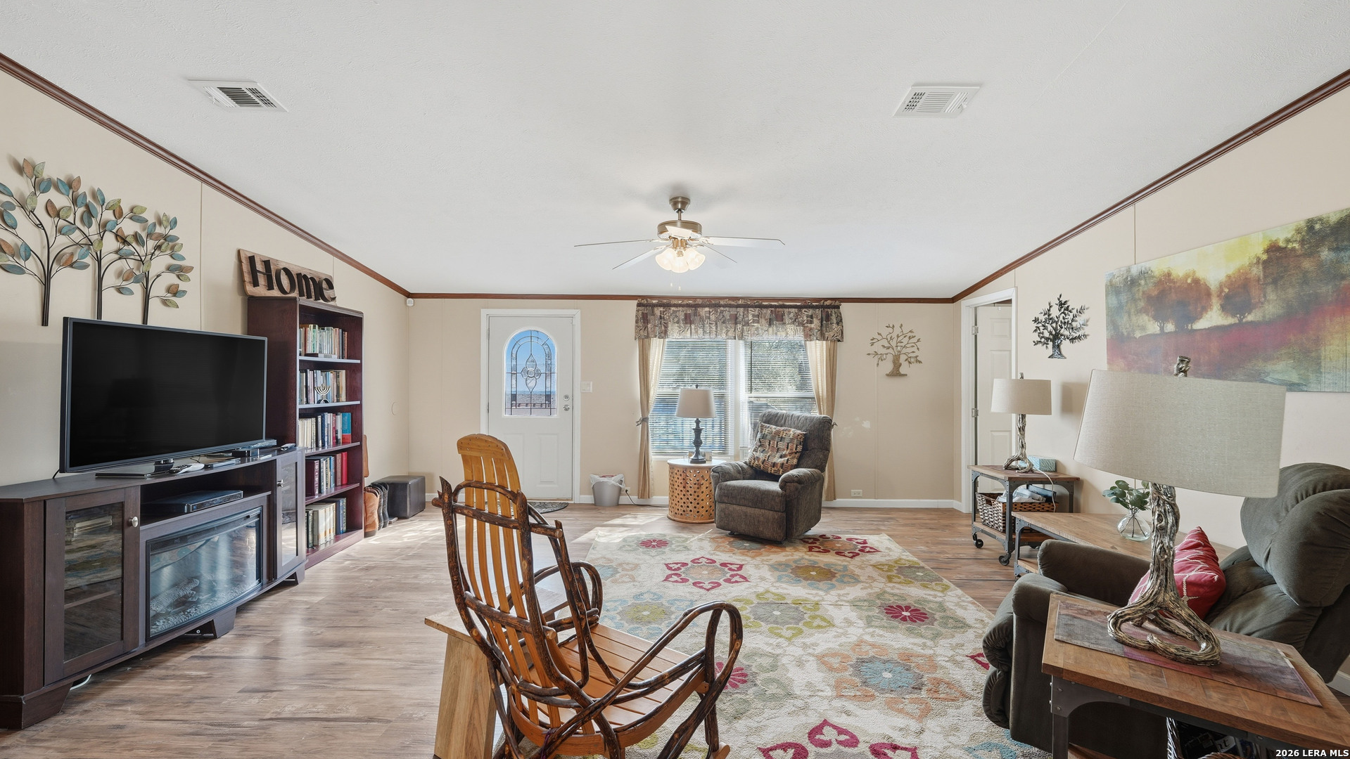 22071 Morin Road Von Ormy, TX 78073 - Photo 15 of 31 a living room with furniture and a flat screen tv