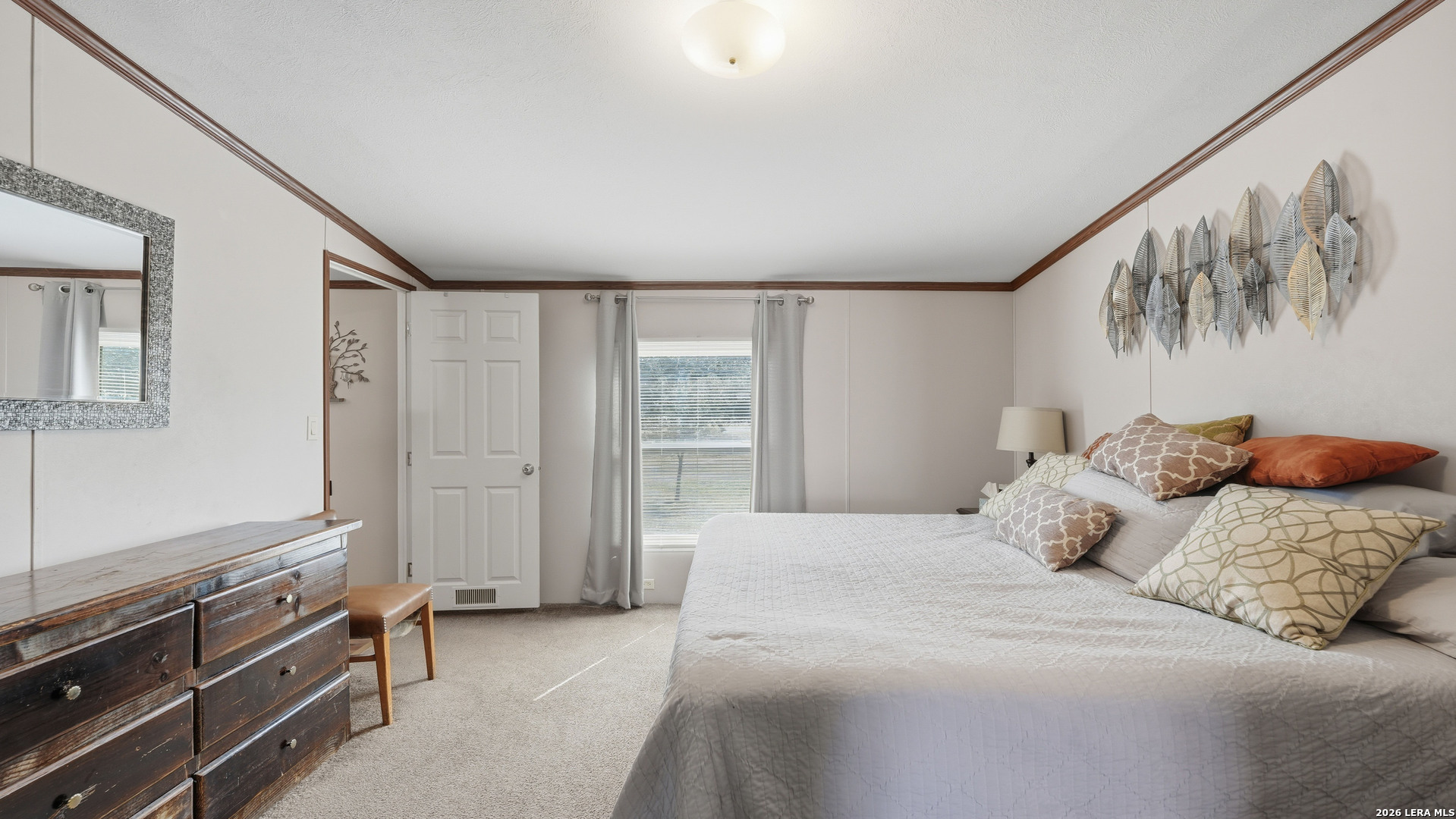 22071 Morin Road Von Ormy, TX 78073 - Photo 16 of 31 a bedroom with a bed and a window