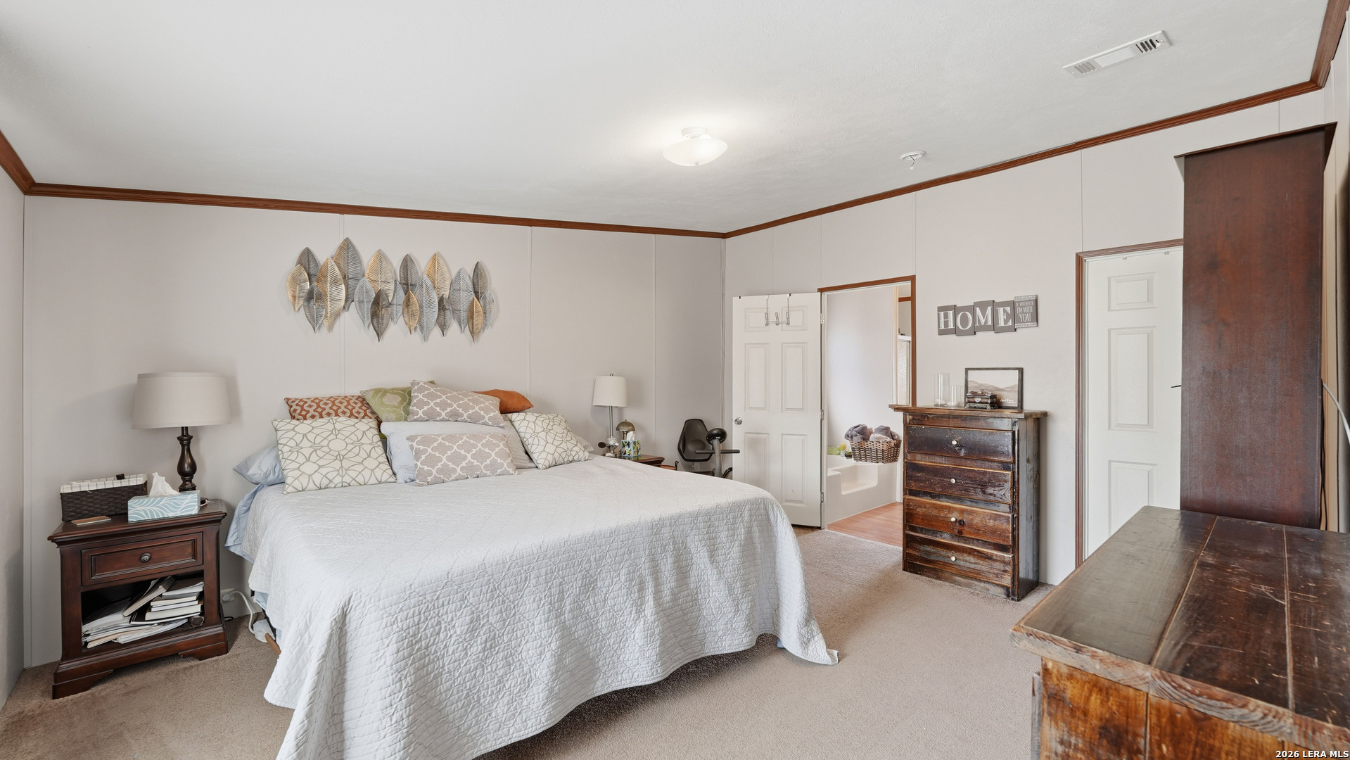 22071 Morin Road Von Ormy, TX 78073 - Photo 17 of 31 a bedroom with a bed and a dresser