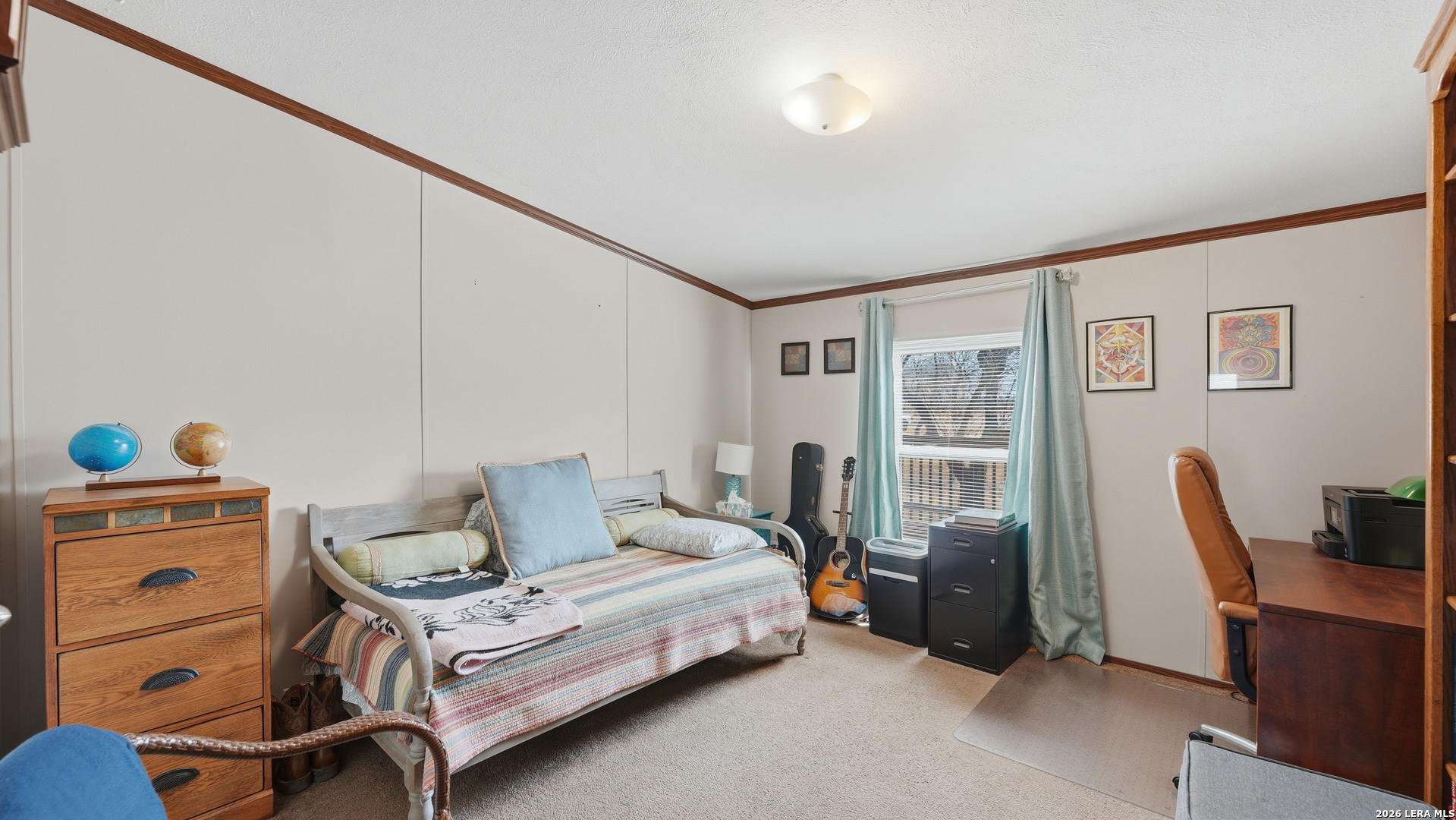 22071 Morin Road Von Ormy, TX 78073 - Photo 21 of 31 a bedroom with furniture and a window