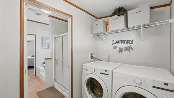 a view of a hallway with washer and dryer