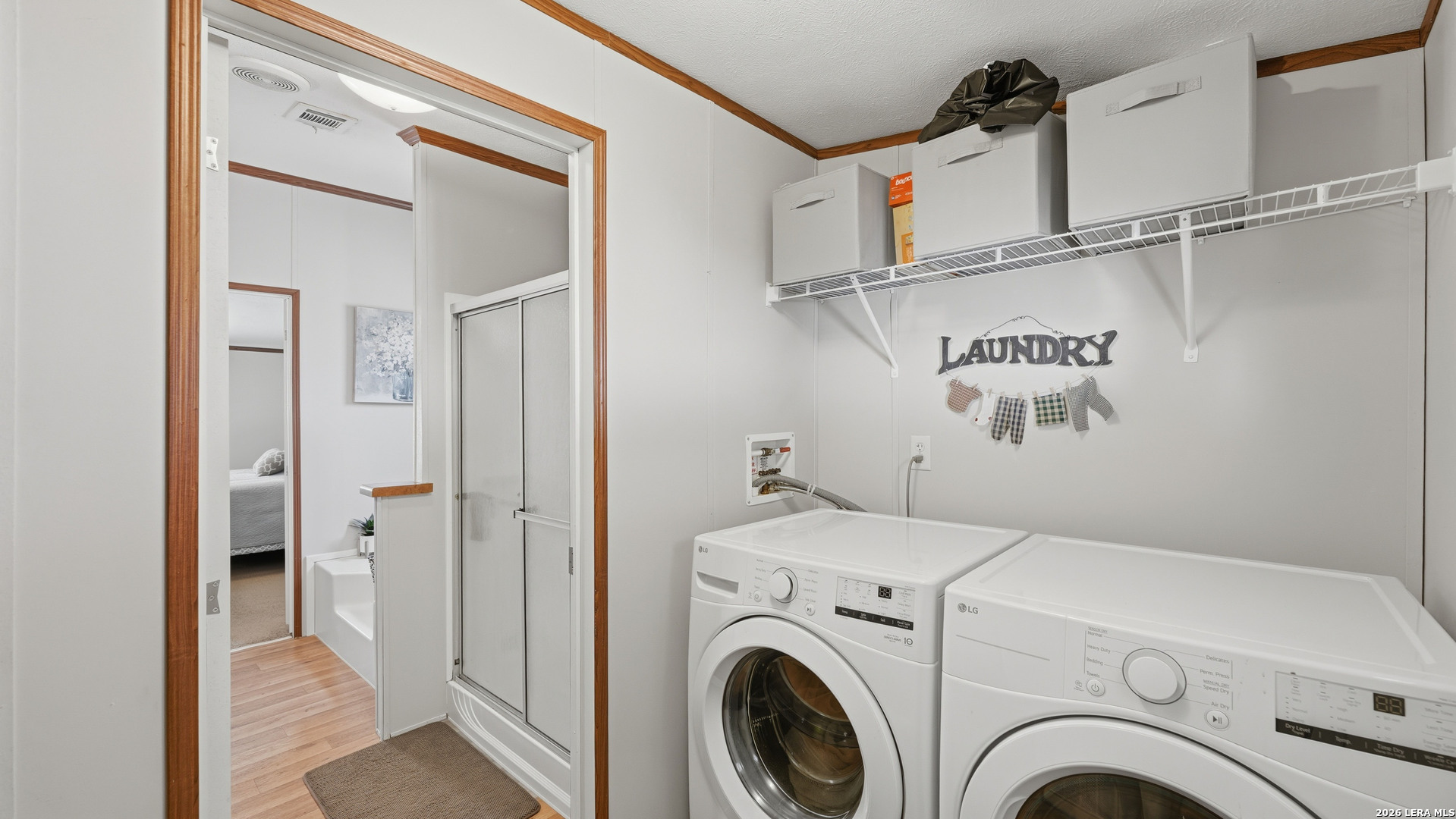 22071 Morin Road Von Ormy, TX 78073 - Photo 24 of 31 a view of a hallway with washer and dryer