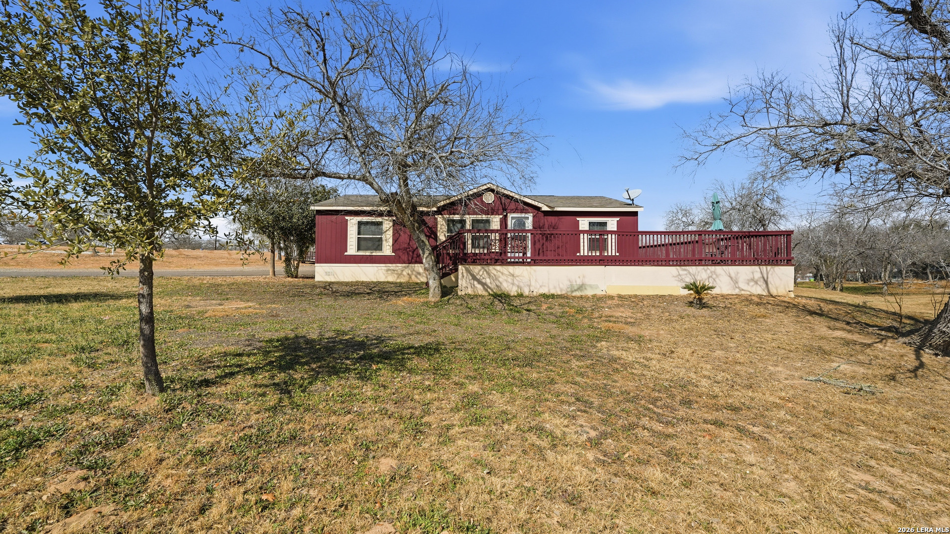 22071 Morin Road Von Ormy, TX 78073 - Photo 25 of 31 a front view of a house with a yard and garage