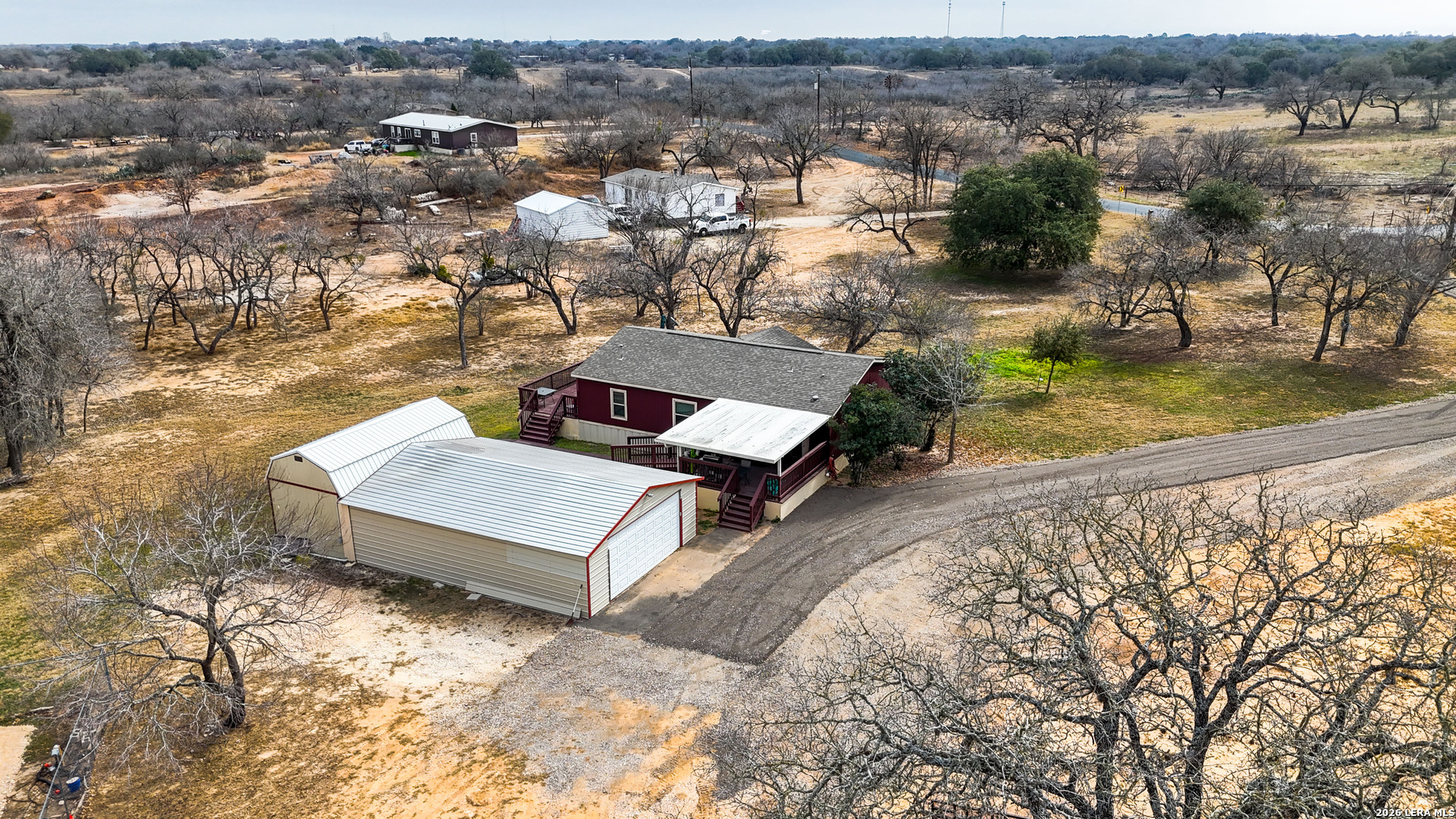 22071 Morin Road Von Ormy, TX 78073 - Photo 29 of 31 an aerial view of a house with a yard and lake view