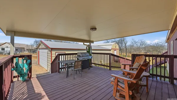 a view of a balcony with chairs
