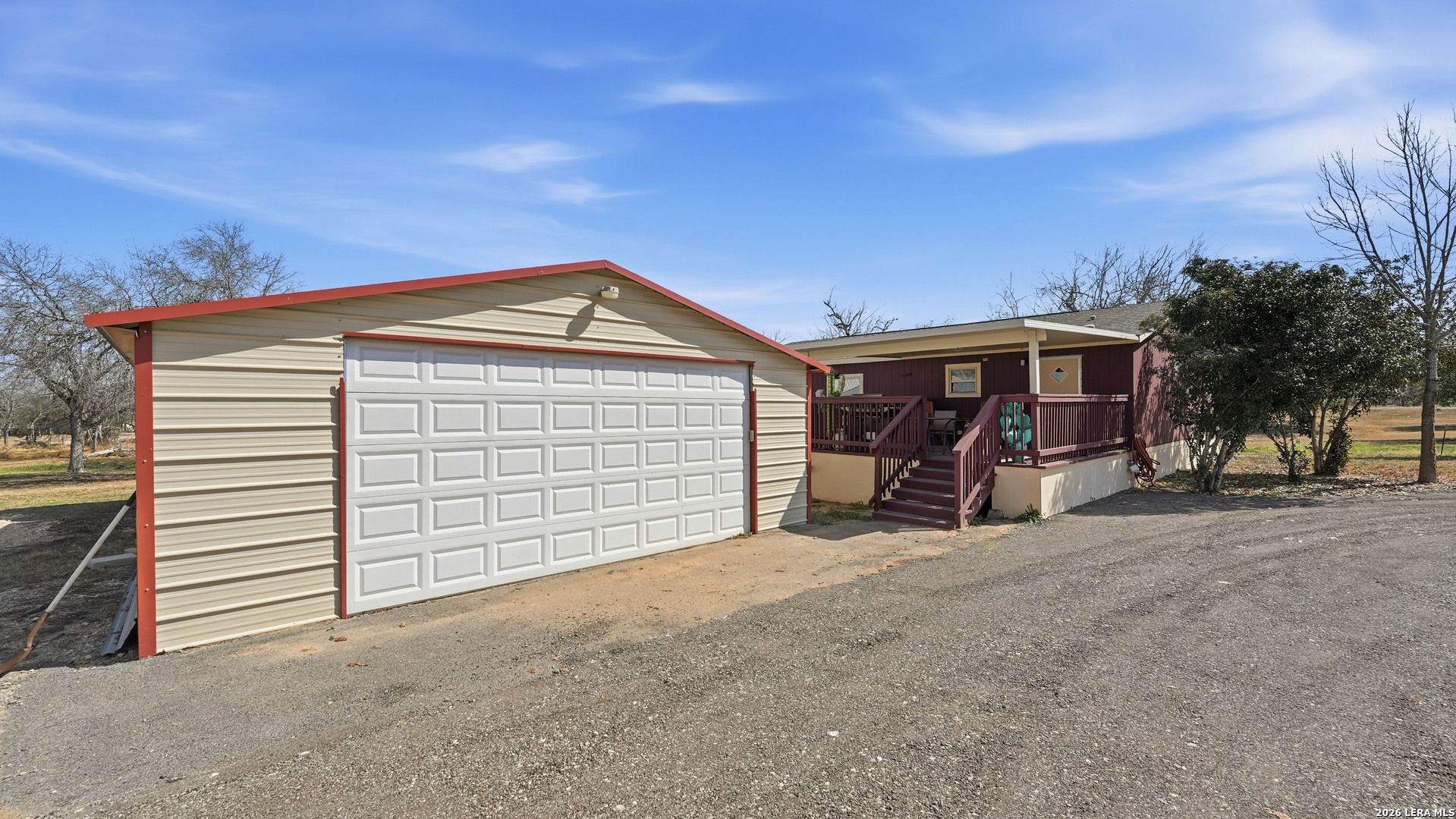 22071 Morin Road Von Ormy, TX 78073 - Photo 6 of 31 a view of a house with a yard and garage