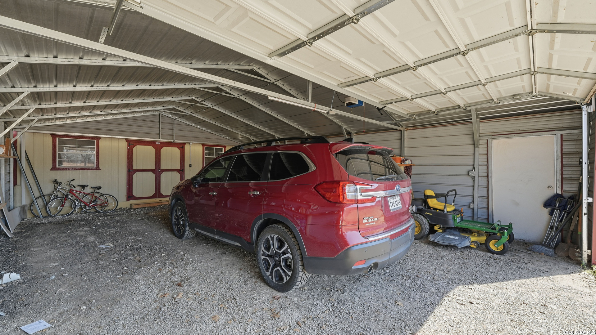 22071 Morin Road Von Ormy, TX 78073 - Photo 8 of 31 a car parked in a garage