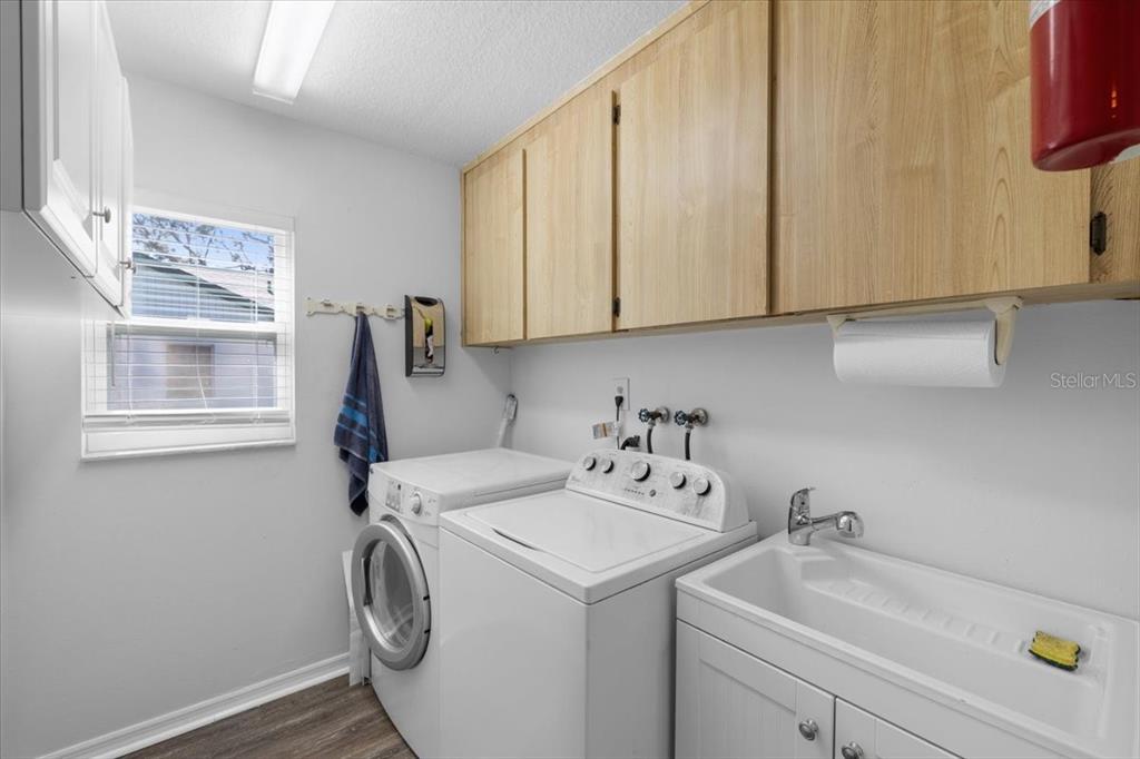 4498 Plumosa Street Spring Hill, FL 34607 - Photo 17 of 24 a utility room with dryer and washer