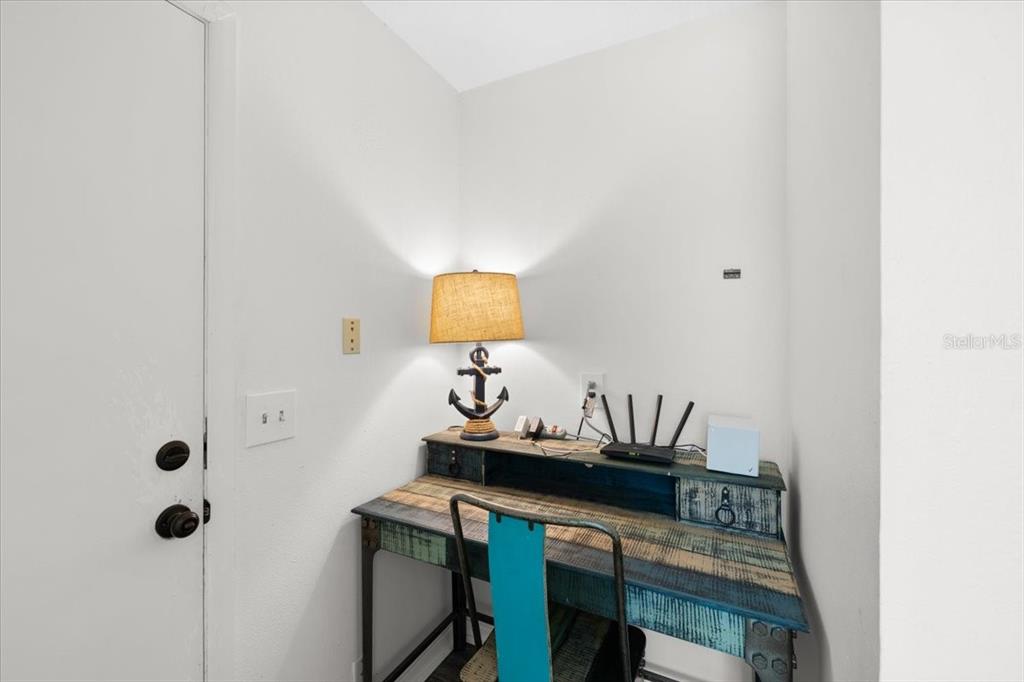 4498 Plumosa Street Spring Hill, FL 34607 - Photo 18 of 24 a room with a table and a mirror