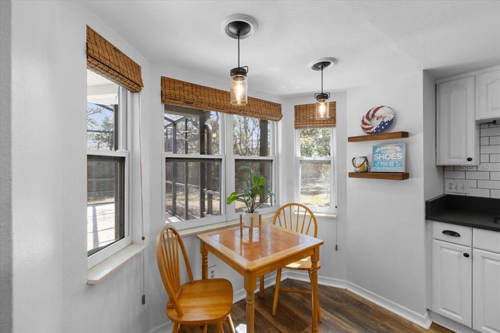 4498 Plumosa Street Spring Hill, FL 34607 - Photo 8 of 24 a dining room with furniture and window