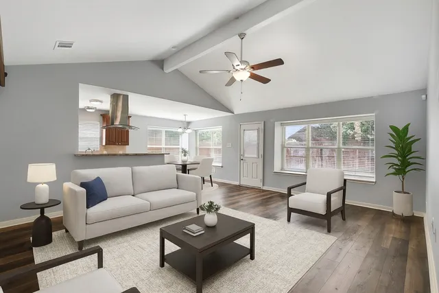 a living room with furniture and a large window
