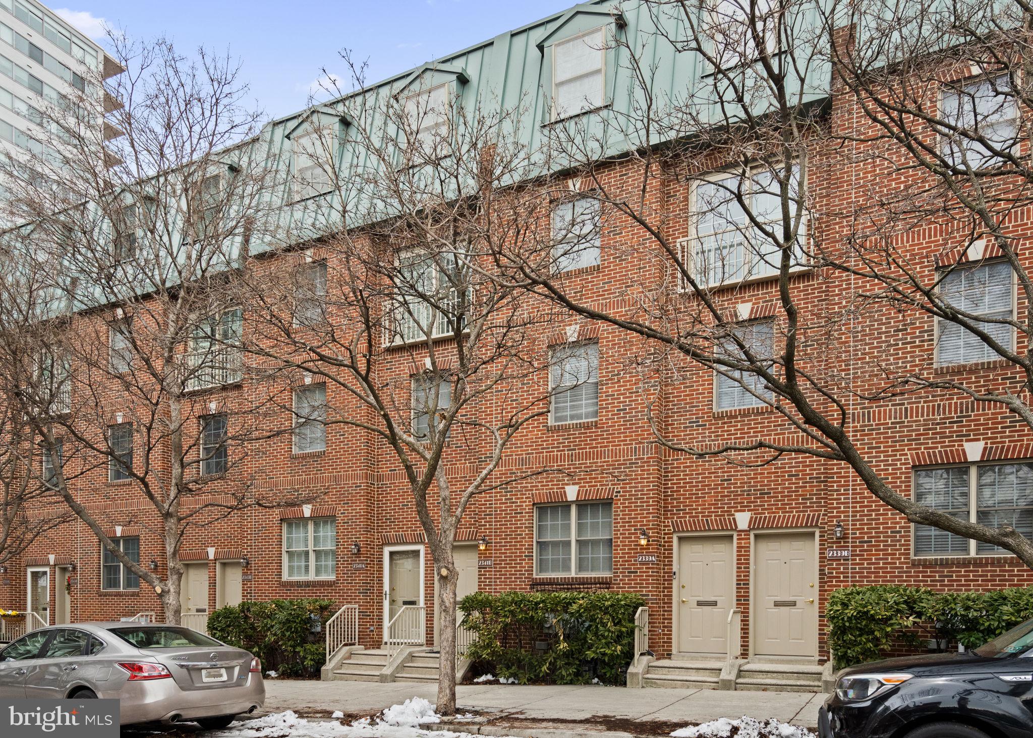 2341 Wallace Street, Unit B Philadelphia, PA 19130 - Photo 1 of 45 a front view of a building with large trees