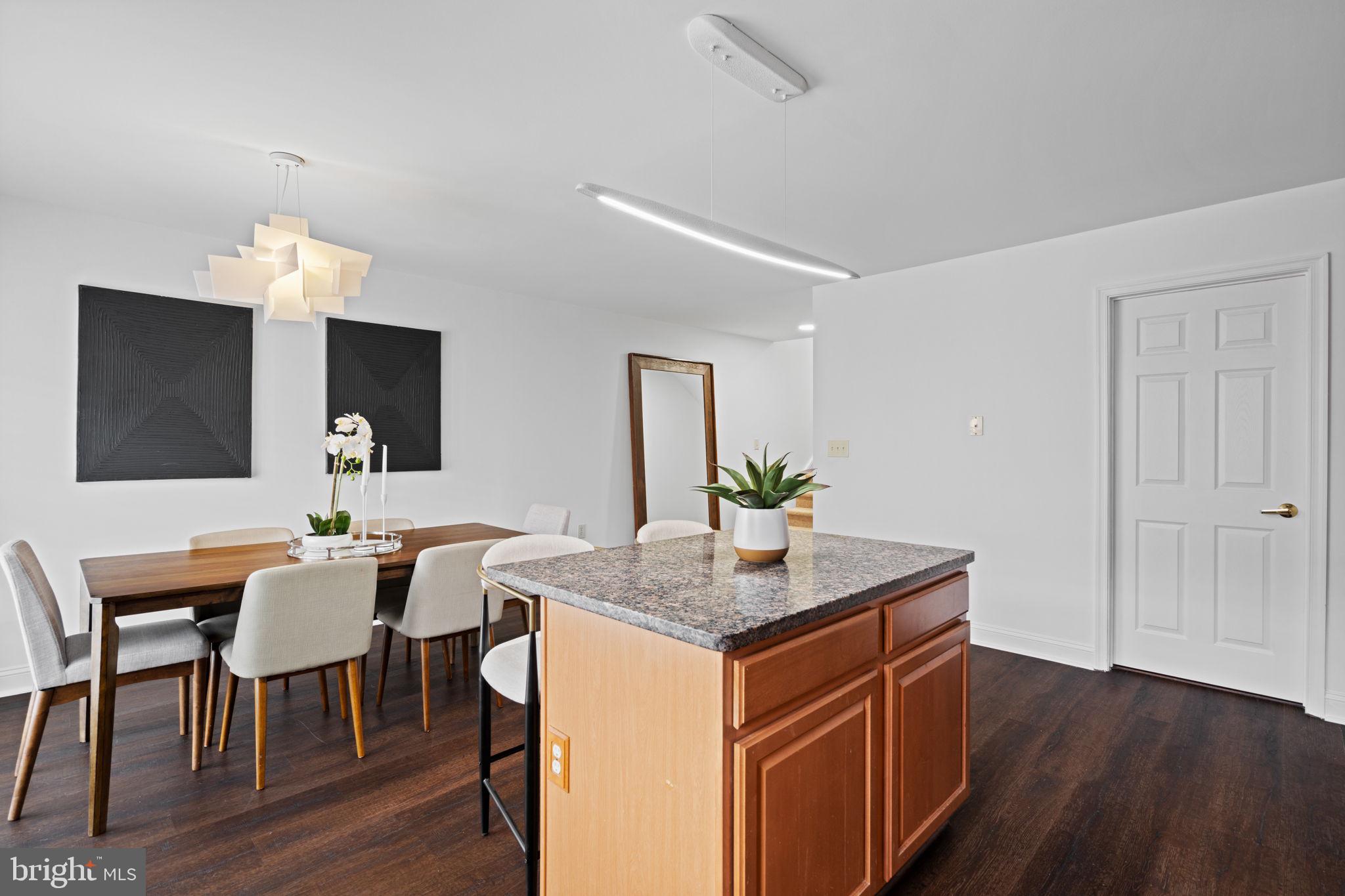 2341 Wallace Street, Unit B Philadelphia, PA 19130 - Photo 19 of 45 a dining room with kitchen island a granite counter tops and a view of living room
