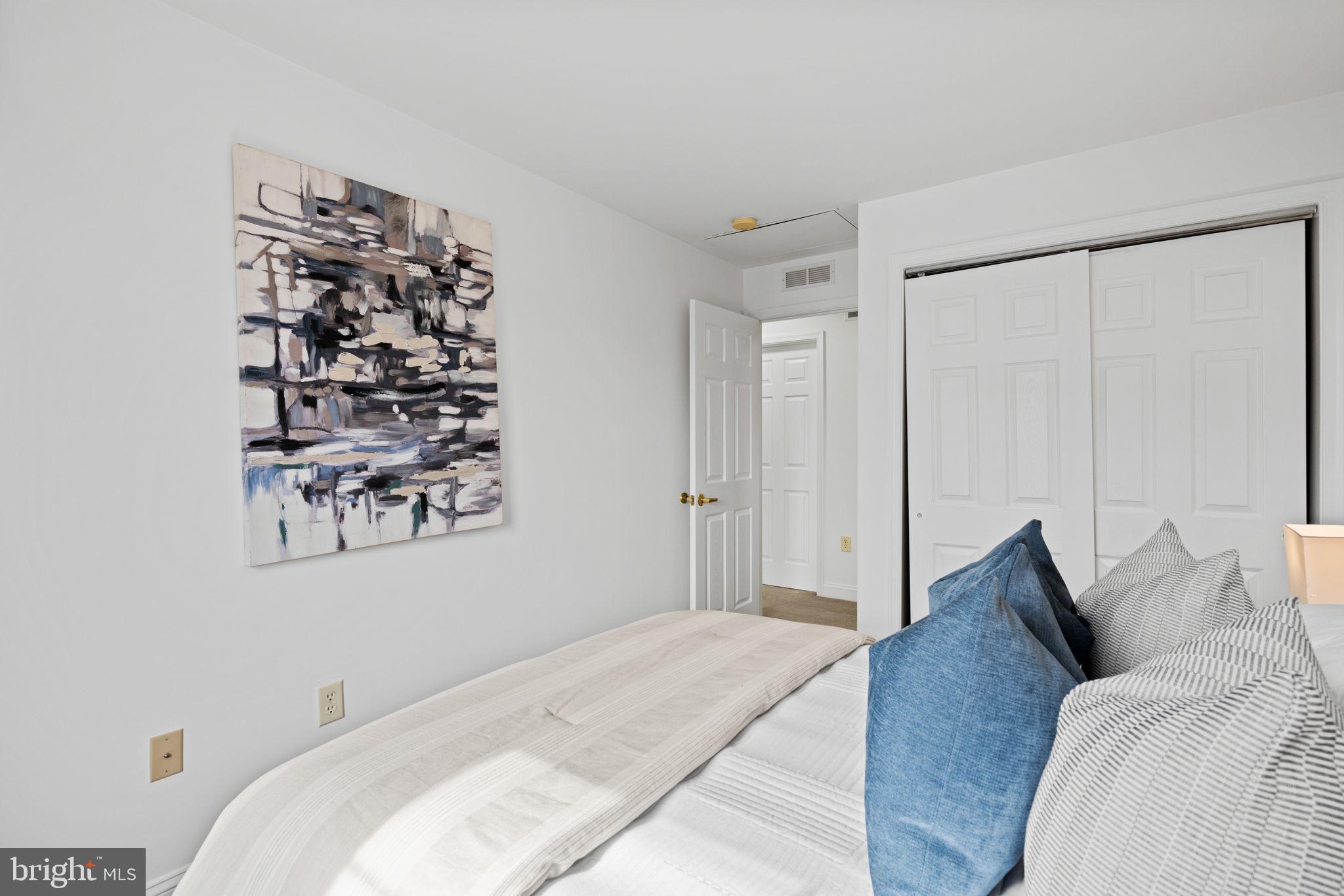 2341 Wallace Street, Unit B Philadelphia, PA 19130 - Photo 27 of 45 a bedroom with a bed and a window