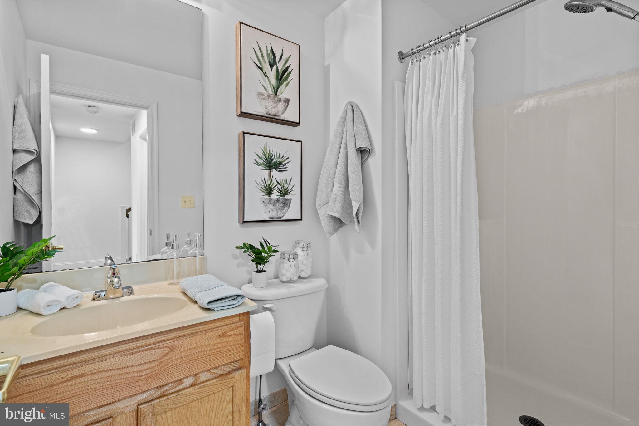 2341 Wallace Street, Unit B Philadelphia, PA 19130 - Photo 28 of 45 a bathroom with a sink toilet and shower