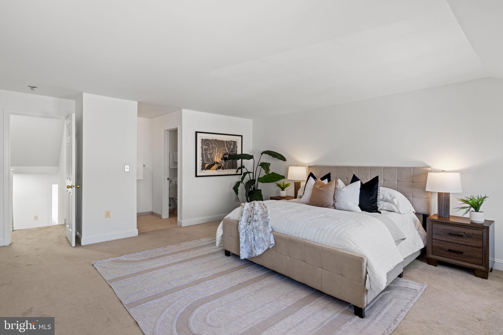2341 Wallace Street, Unit B Philadelphia, PA 19130 - Photo 34 of 45 a spacious bedroom with a bed and a lamp