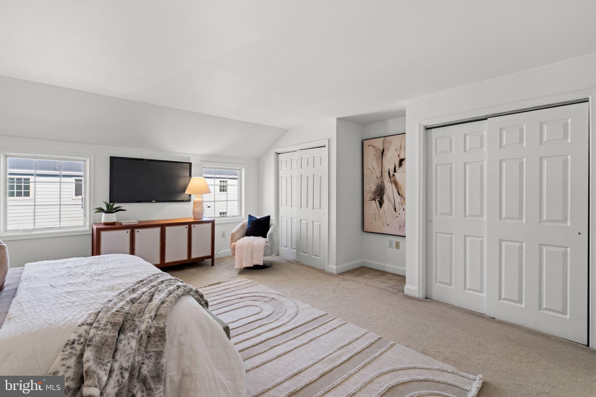2341 Wallace Street, Unit B Philadelphia, PA 19130 - Photo 35 of 45 a bedroom with a bed and a flat screen tv