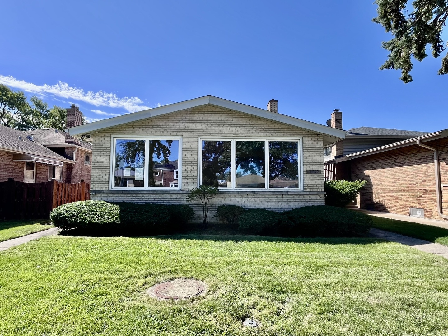 4939 Fargo Avenue Skokie, IL 60077 - Photo 1 of 20 a front view of a house with a yard