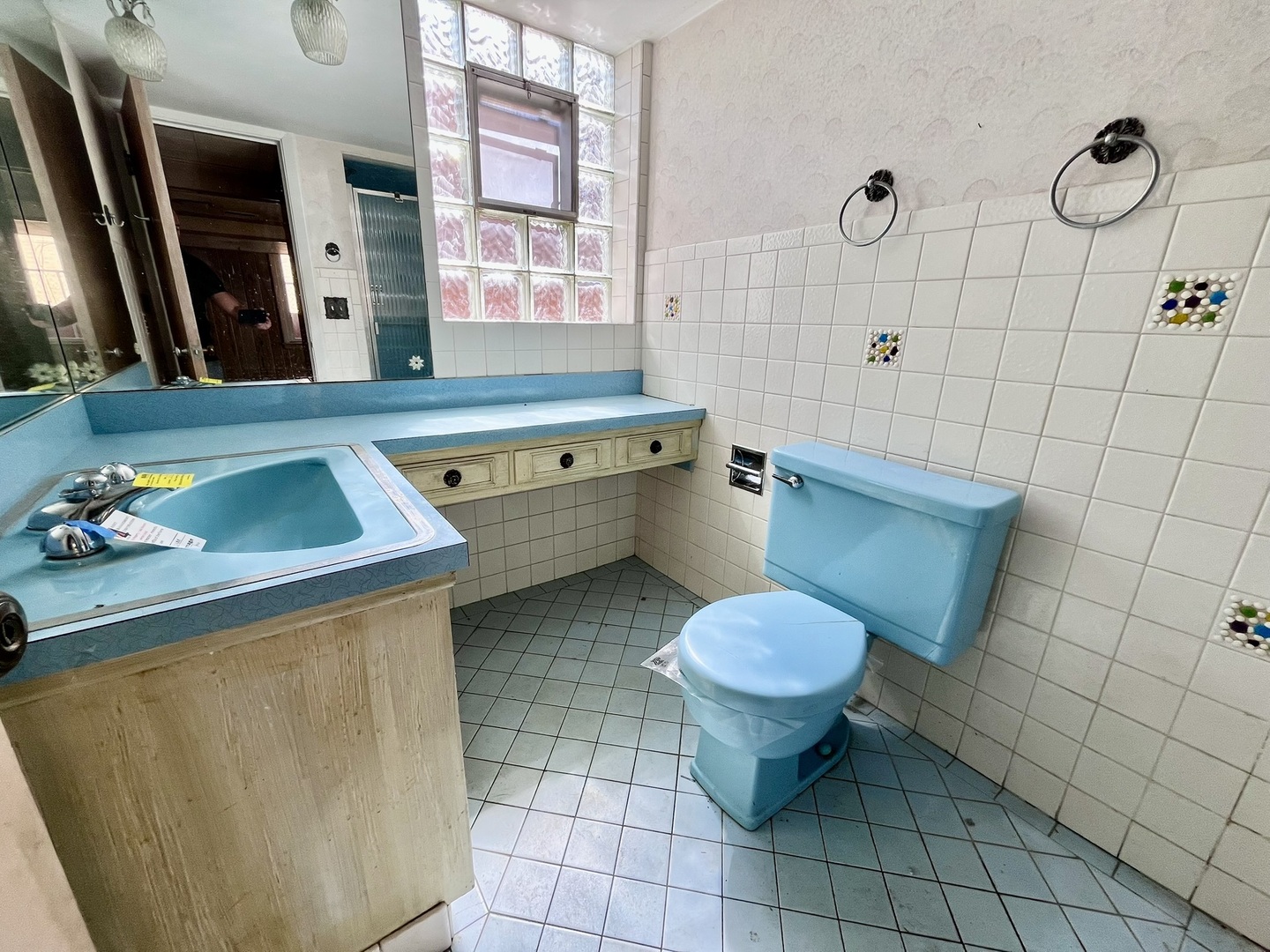 4939 Fargo Avenue Skokie, IL 60077 - Photo 12 of 20 a bathroom with a toilet sink and mirror
