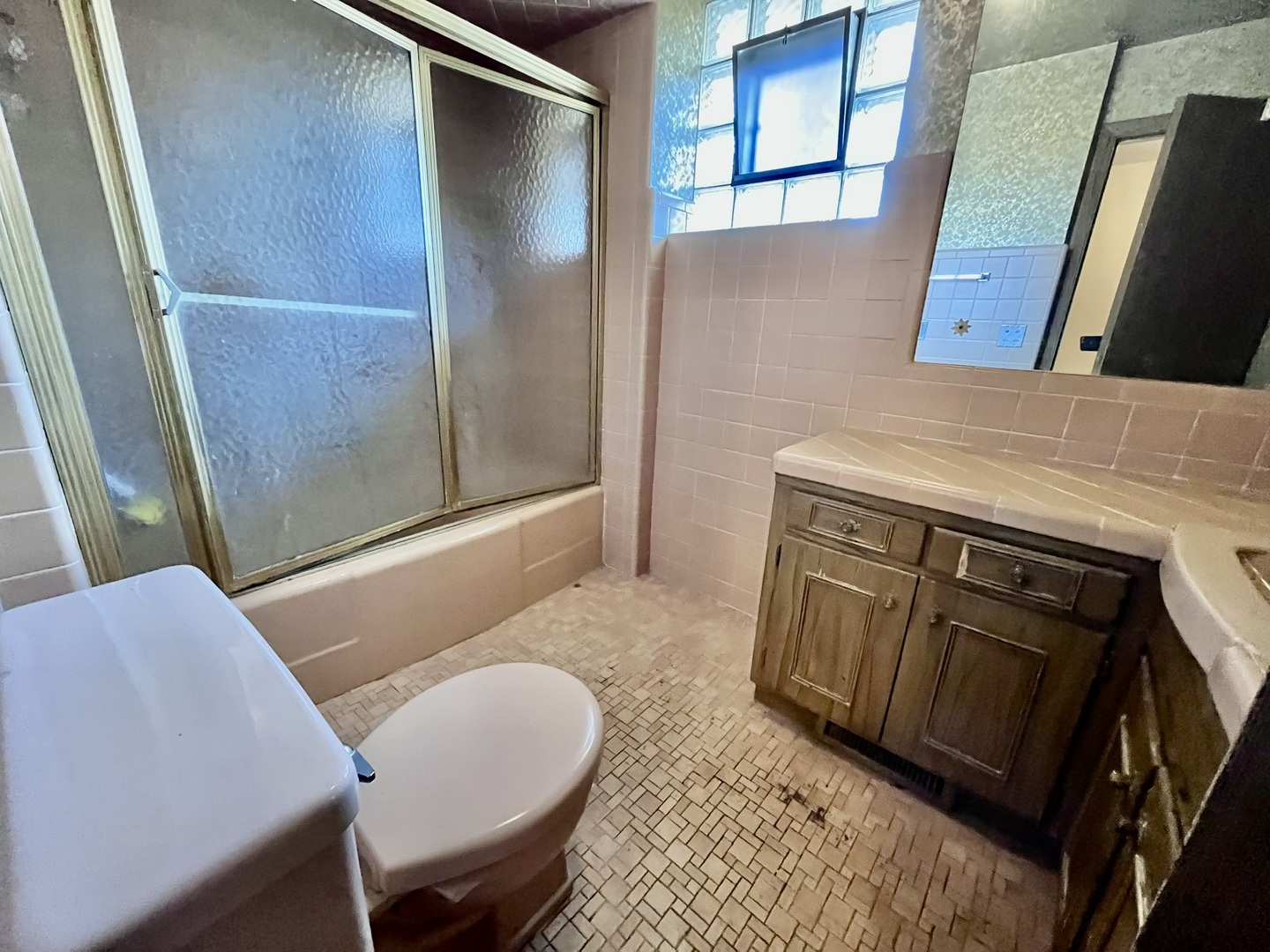 4939 Fargo Avenue Skokie, IL 60077 - Photo 14 of 20 a bathroom with a sink a mirror and a toilet