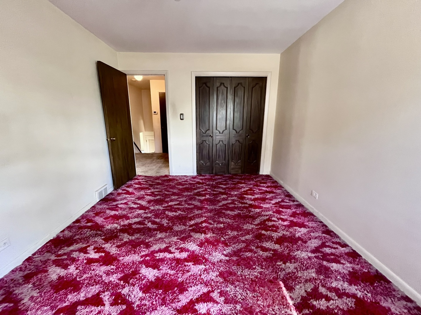 4939 Fargo Avenue Skokie, IL 60077 - Photo 15 of 20 a bedroom with a bed and a mirror