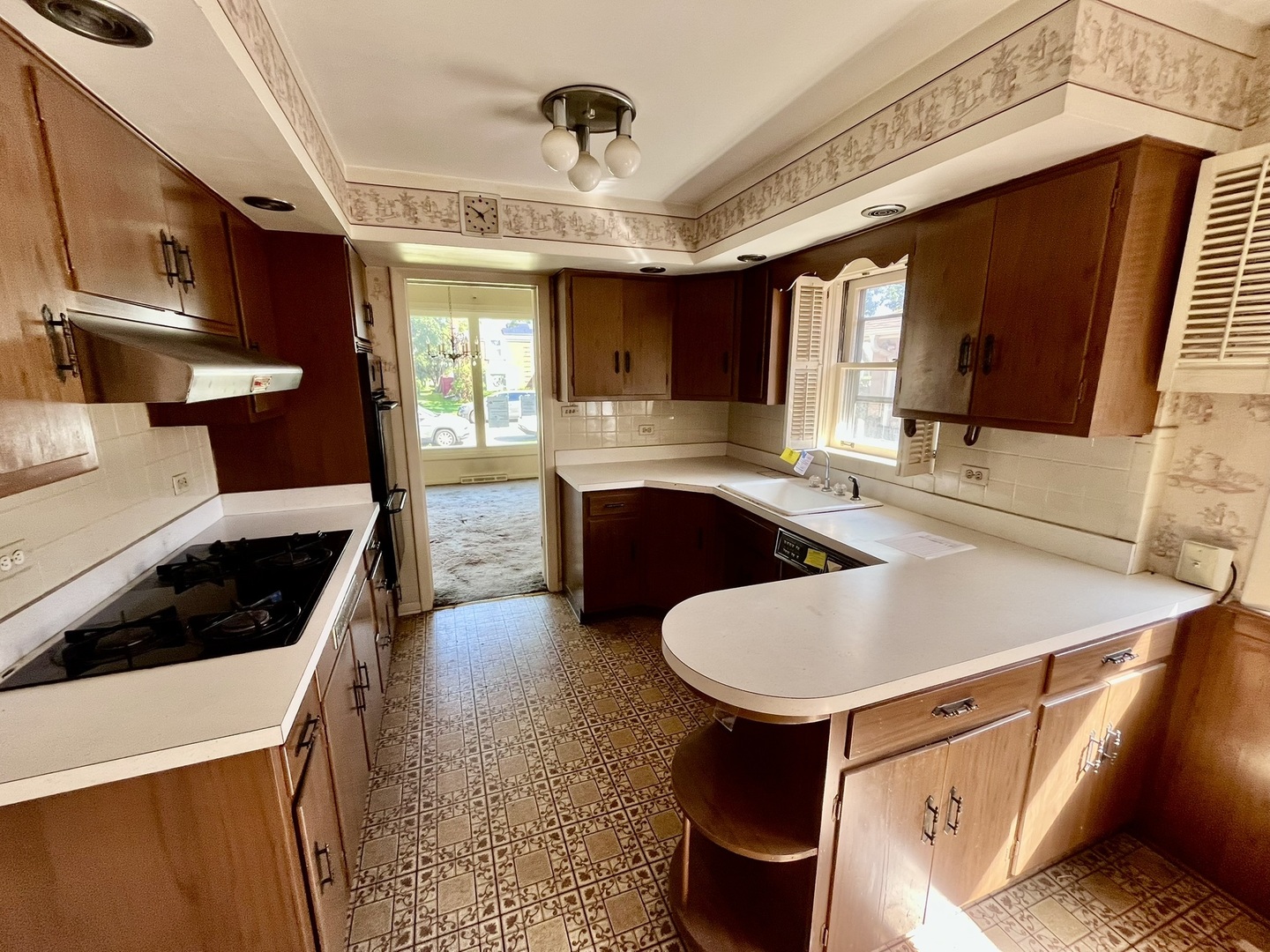 4939 Fargo Avenue Skokie, IL 60077 - Photo 8 of 20 a kitchen with stainless steel appliances granite countertop a sink a stove and a refrigerator
