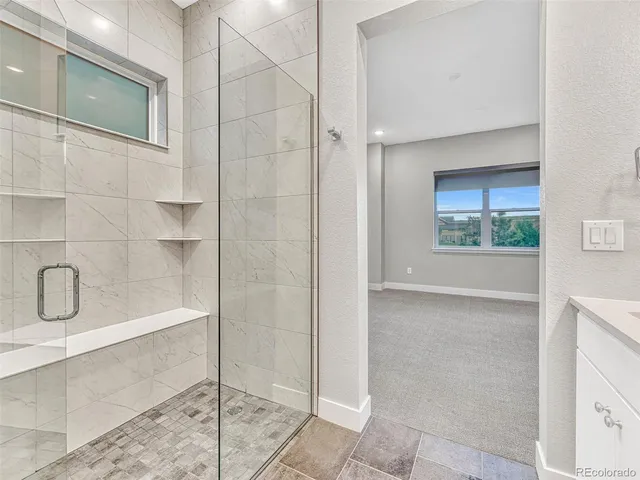 a bathroom with a bathtub and shower