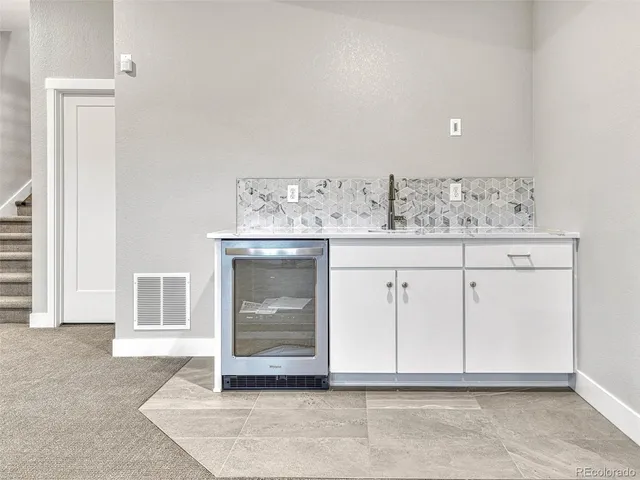 a bathroom with a sink double vanity and a bathtub