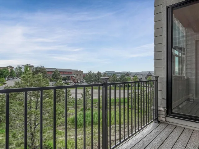 a view of a yard with wooden fence