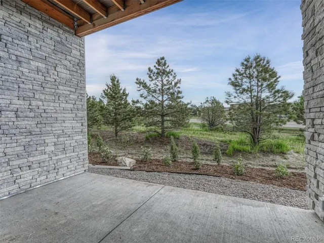 a front view of a house with brick walls