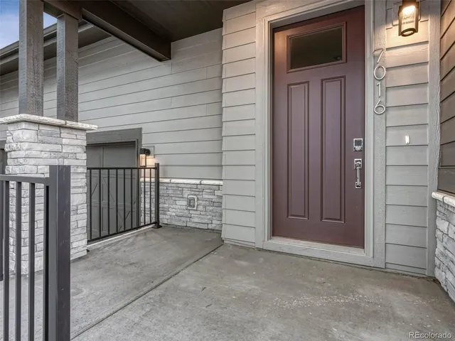 a front view of a house with garage and garage