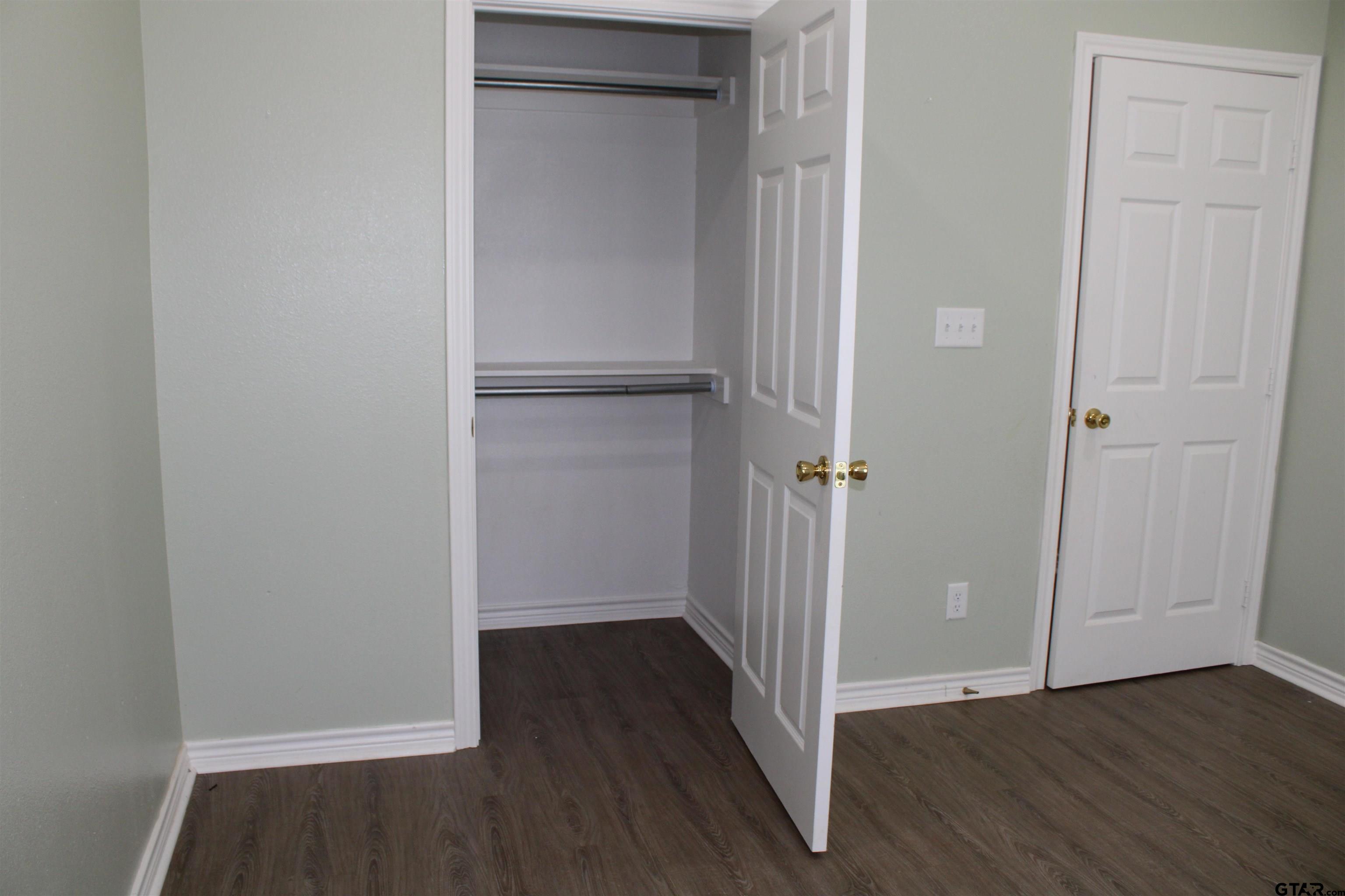 14965 Turtle Crk Rnch Road Flint, TX 75762 - Photo 18 of 26 a view of a hallway with wooden floor