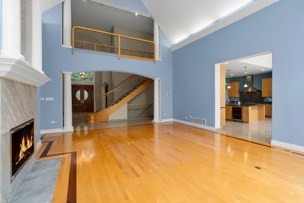 a bedroom with a balcony a large bed and a window