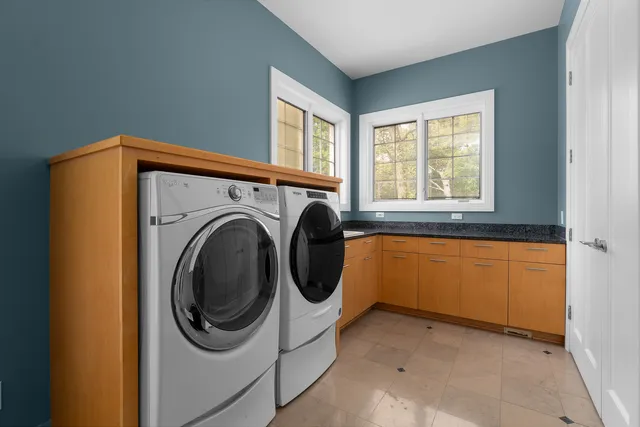 a view of a room with wooden floor and a window