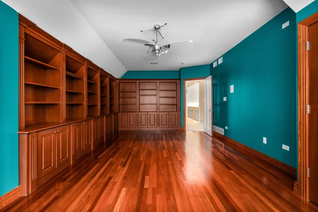 a bedroom with a large bed and a large window