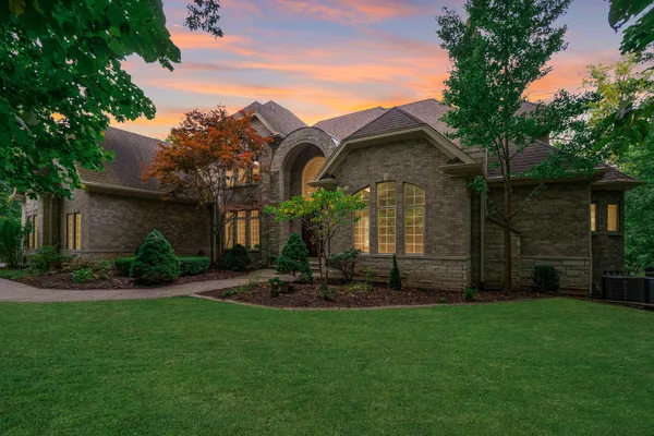 a front view of a house with garden