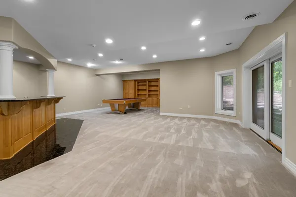 a view of an empty room with windows