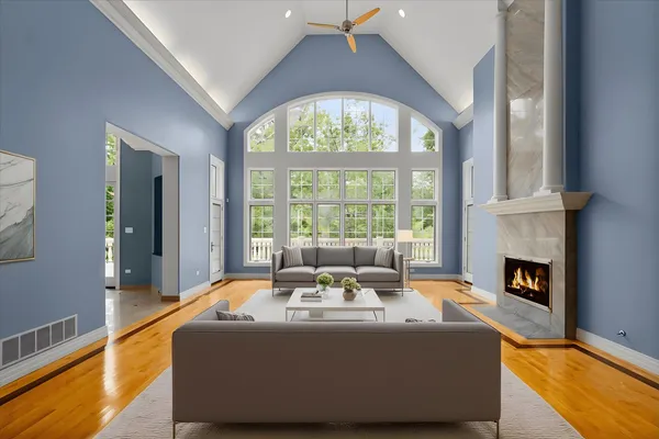 a view of an empty room with a fireplace and a window