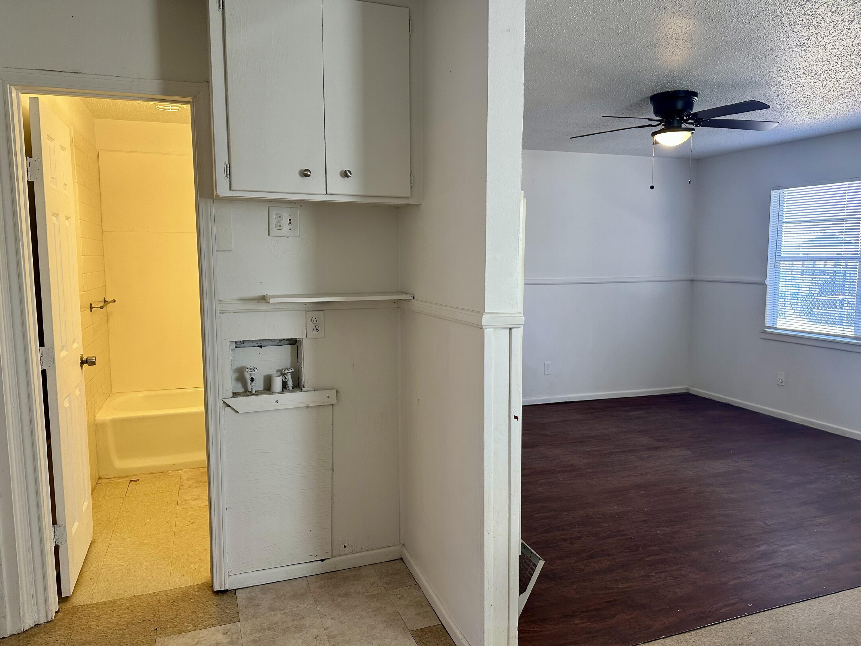 1119 46th Street, Unit B Lubbock, TX 79412 - Photo 5 of 9 a view of storage utility room with a window