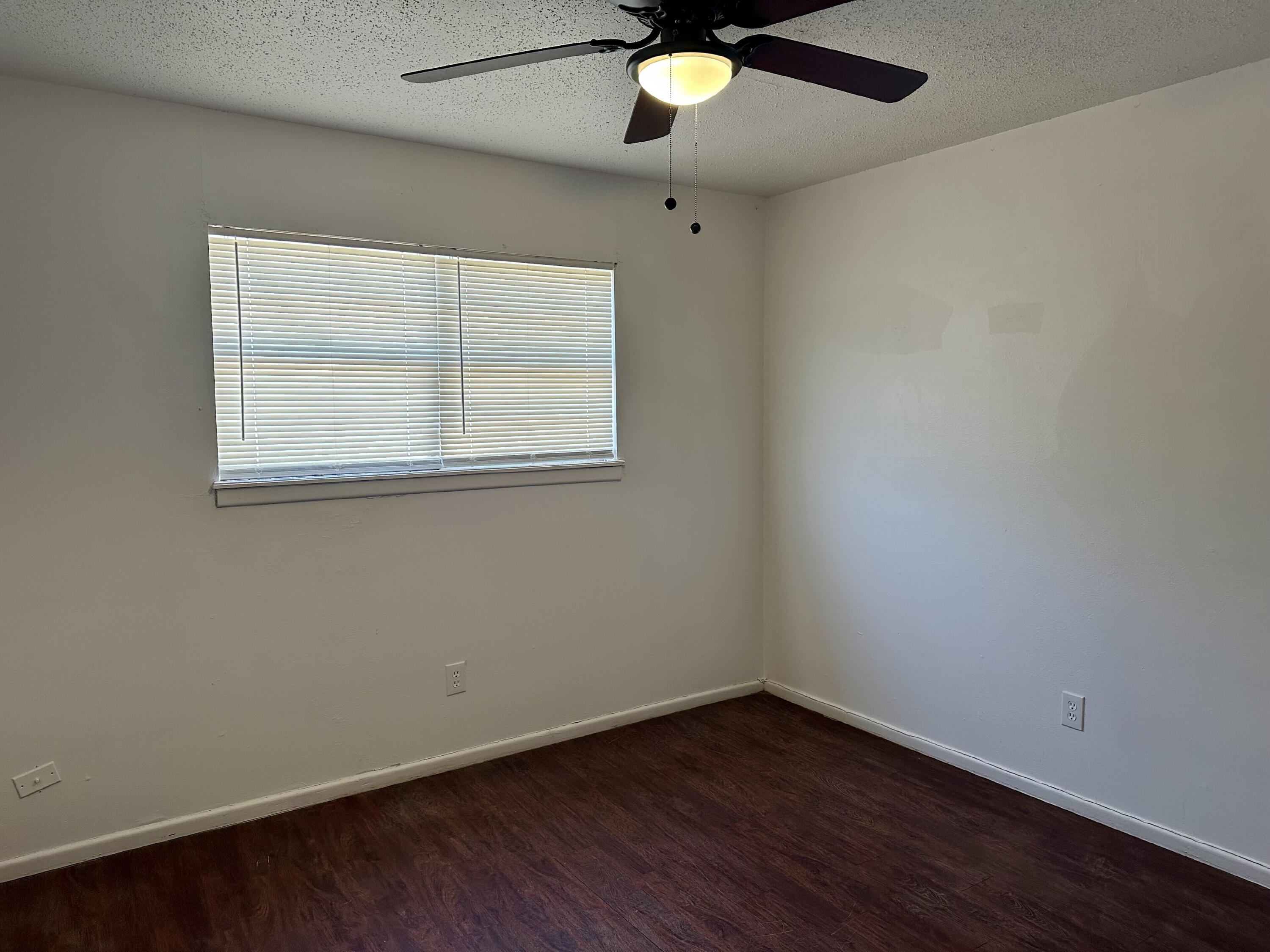 1119 46th Street, Unit B Lubbock, TX 79412 - Photo 9 of 9 an empty room with a window