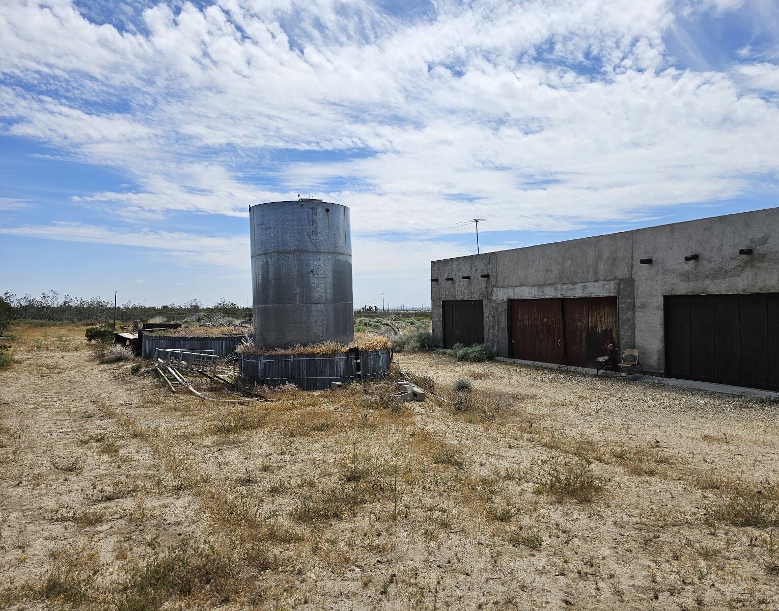 Gaskell Road Rosamond, CA 93560 - Photo 12 of 50 a view of a dry yard with wooden fence
