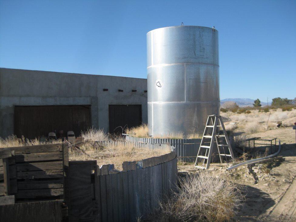 Gaskell Road Rosamond, CA 93560 - Photo 9 of 50 a kitchen with a table and chairs in it