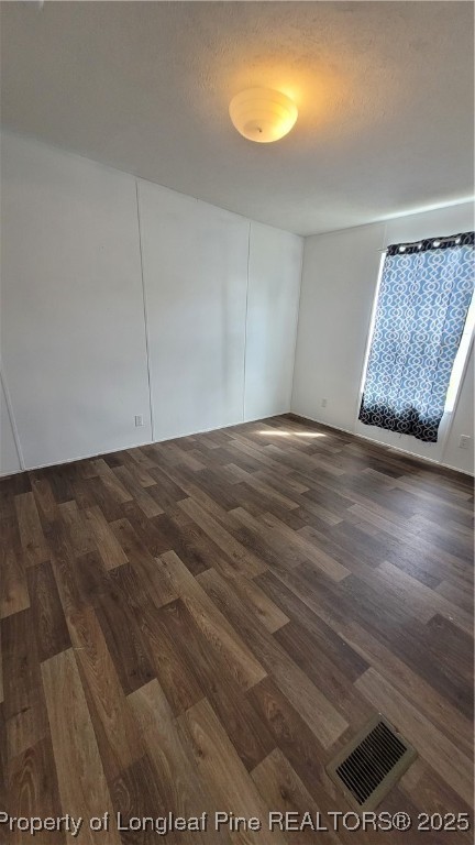 1235 Martin Road St. Pauls, NC 28384 - Photo 18 of 28 a view of an empty room with wooden floor and a window